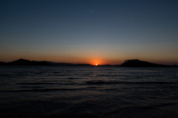 Sunset at Agios Georgios beach in Chora of Naxos island, Cyclades, Greece
