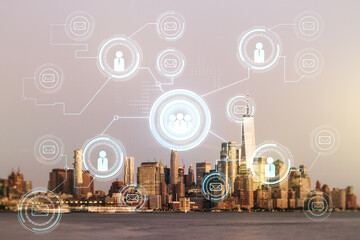 Double exposure of abstract virtual social network icons on New York city skyscrapers background. Marketing and promotion concept