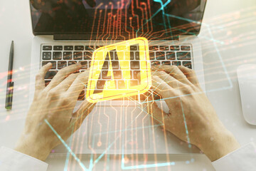 Double exposure of creative artificial Intelligence icon with hands typing on laptop on background. Neural networks and machine learning concept