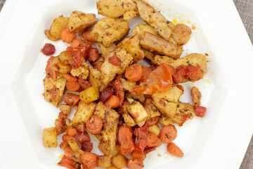 Overhead View of Chicken with Tomatoes and Carrots Meal