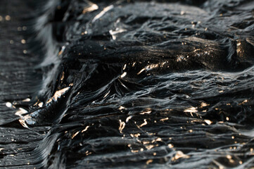 creative dark background. oil production concept. crude oil close up