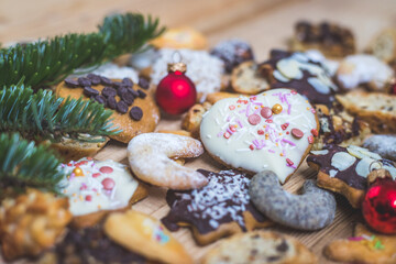 Homemade Christmas cookies: Delicious cookies, powdered sugar and Christmas bauble on rustic wooden table