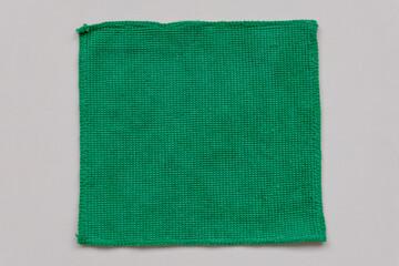 green fabric patch on white background