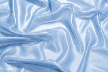 Blue shiny pearl fabric as a background.