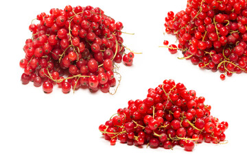 Tasty red currant isolated on white background.