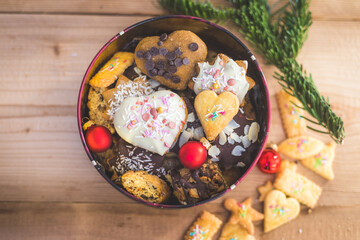Homemade Christmas cookies: Delicious cookies, powdered sugar and Christmas bauble on rustic wooden table