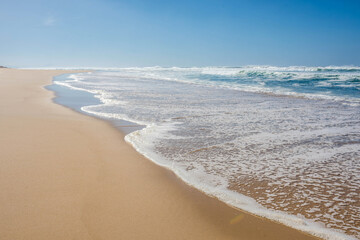 small wave at the edge of a lagoon