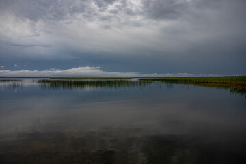 Fototapeta na wymiar landscape of Latvian largest lake Razna, calm water in summer evening light. 