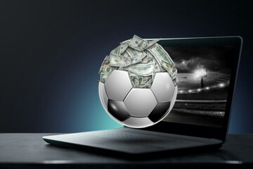 Dollars are inside the soccer ball, the ball is full of money. Sports betting, soccer betting, gambling, bookmaker, big win.