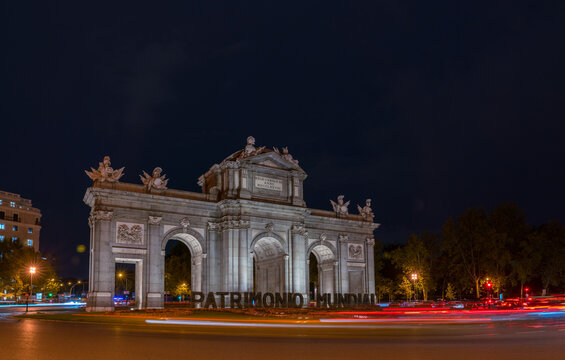 Long Exposure Picture of La Puerta de Alcala with Traffic around it at night