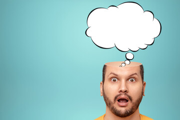 The man thought about it, a sketch of the Cloud Bubble hangs over his head. The concept of dreams, thoughts, idea. Close-up portrait. Creative background, copy space.