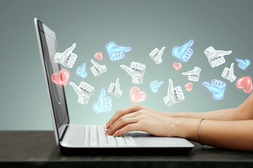 Successful social media advertising strategy. A lot of likes fly out of the laptop. The concept of...