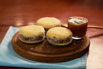 Soft homemade Argentine alfajores filled with caramel. Traditional Argentine pastry.