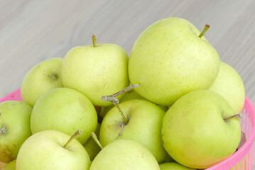 ripe yellow apples in a basket,all natural hormone-free apples,