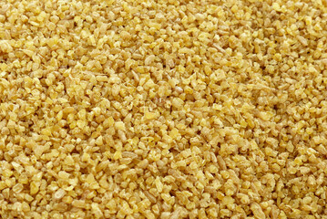 Organic bulgur made from wheat for pilaf in a bowl, close-up bulgur,