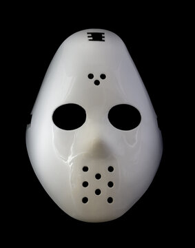 White Hockey Mask Isolated Against Black Background