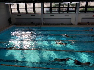 Swimming laps in an indoor pool