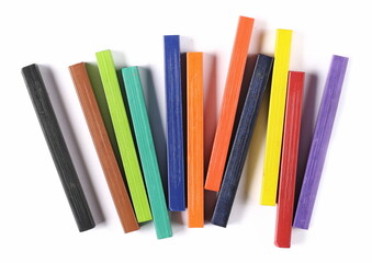 Colorful chalks pile set isolated on white background, top view