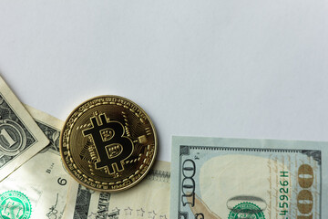 United States currency and bitcoin on a white background
