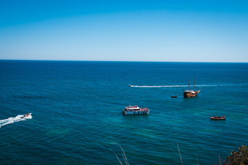 beach with blue sea on the slope