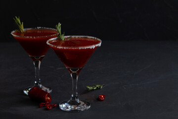 Bloody Mary cocktail. Alcoholic drink with vodka and tomato juice in a glass isolated on a black background. vampiro cocktail with pepper on a busy bar top. copy space.