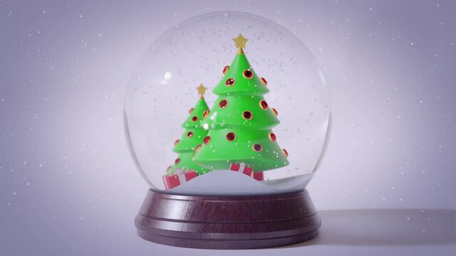 Falling snow inside glass snow globe. Dynamic sparkles, snowflakes. Green colored Christmas trees, presents, gifts. Merry Christmas, New Year mood. Traditional souvenir. White background. 3D Render 4K