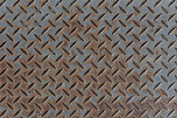 Background of rusty metal diamond pattern plate