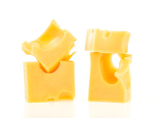 Cheese cube isolated on a white background. Slices of cheese. Pieces of cheese.