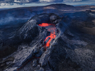 Crater opening from Fagradalsfjall volcano. View from above into the volcanic crater with strong...