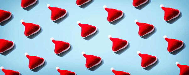 Pattern of small santa hats - overhead view flat lay