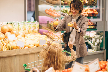 Mother with daughter at a grocery store