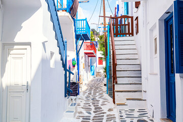 Mykonos old town cozy narrow street with white houses. Mykonos island, Greece