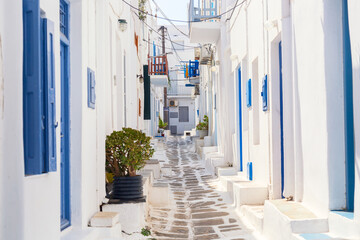 Fototapeta na wymiar Famous old town narrow street with white houses. Mykonos island, Greece