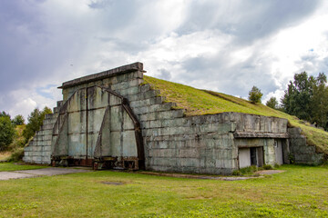 Fototapeta na wymiar Hangars at a former military airport in northern Czech republic, used by the Soviet army.