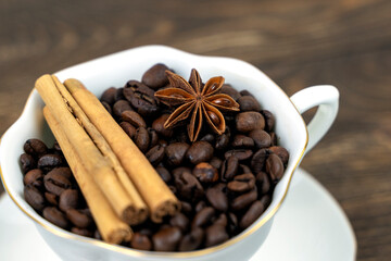 cup of coffee and anise on a wooden background