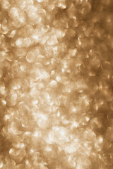 Golden glitter background with small particles