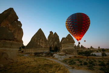 Fototapeta na wymiar Fairy Chimneys and Hot Air Ballooons in Cappadocia Turkey