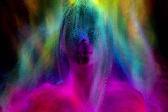 multicolor portrait beautiful woman with, colorful light on black background lgbt pride concept