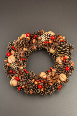 Autumn wreath of cones, nuts, and berries. Creative composition, the handmade
