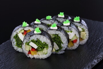 sushi on a plate with chopsticks
