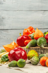 Trendy ugly organic vegetables and fruits on stone concrete background