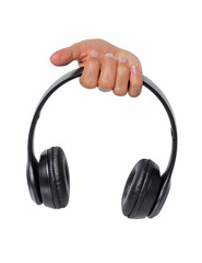 Female hand hold a stereo music headphones isolated on white background.