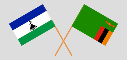 Crossed flags of the Kingdom of Lesotho and the Republic of Zambia. Official colors. Correct proportion