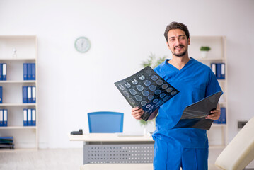 Young male doctor radiologist working in the clinic