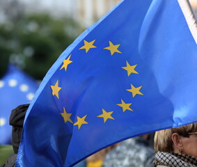 european union flag holds by protester during street public protest to support  Poland as EU...