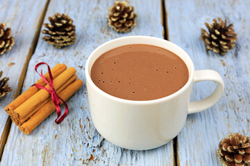 cup of hot chocolate with Cinnamon sticks.
