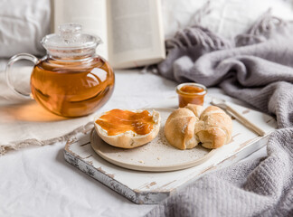 breakfast in bed bread and butter, apricot jam and tee