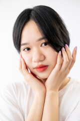 Clean skin. Asian beauty. Female facial treatment. Rejuvenation procedure. Pretty japanese woman posing isolated white.