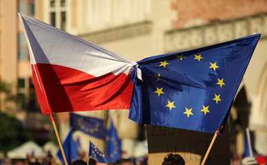 European union flag tied togehter on street demonstration to support Polands membership in EU - obrazy, fototapety, plakaty