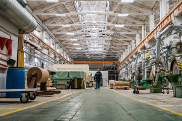 Wood factory workshop, production wooden molds and steel machinery equipment, industrial interior.